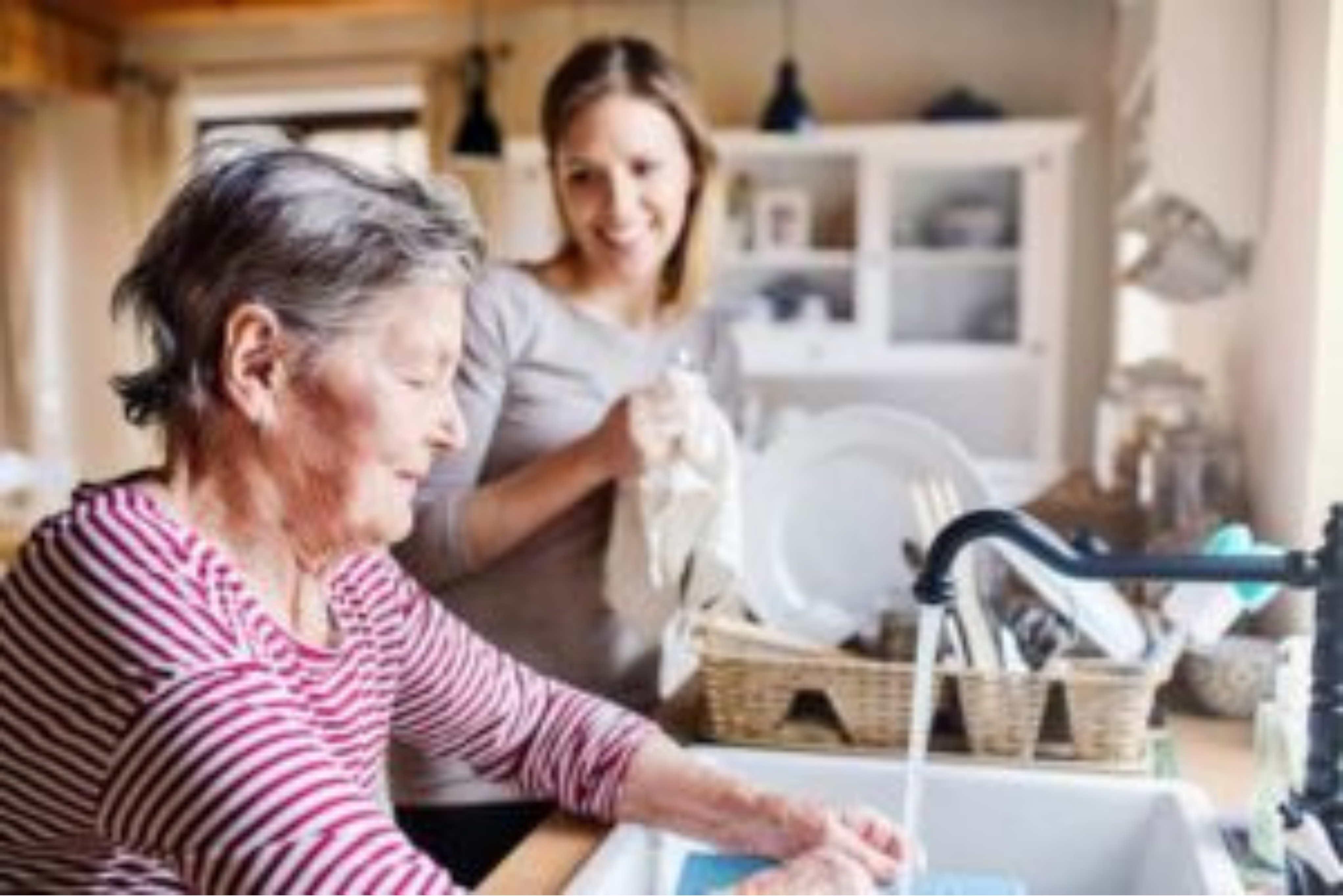 This image shows a senior woman receiving support with domestic tasks, symbolising help with daily home responsibilities like cooking, shopping, and light maintenance.