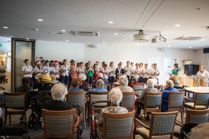 Mount St Benedict students sing carols to McQuoin Park residents